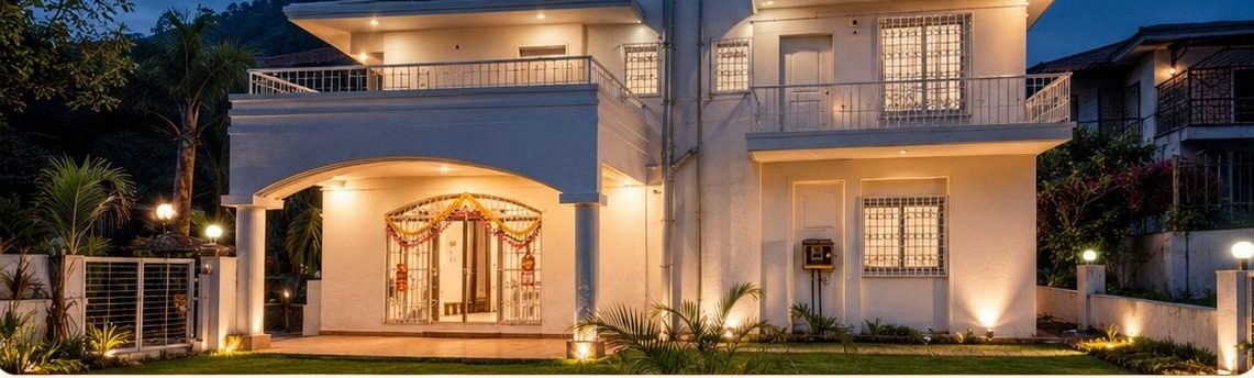 3-BHK villa at Inara Retreats at dusk, lit up with garden lighting