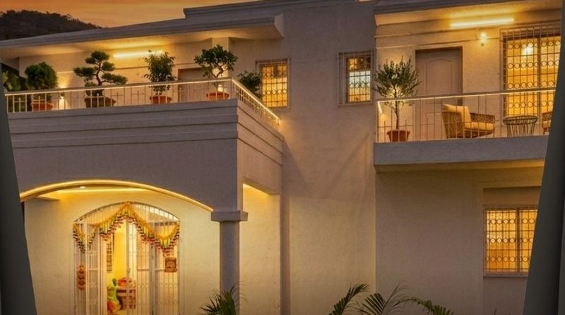 Villa balconies warmly lit at night